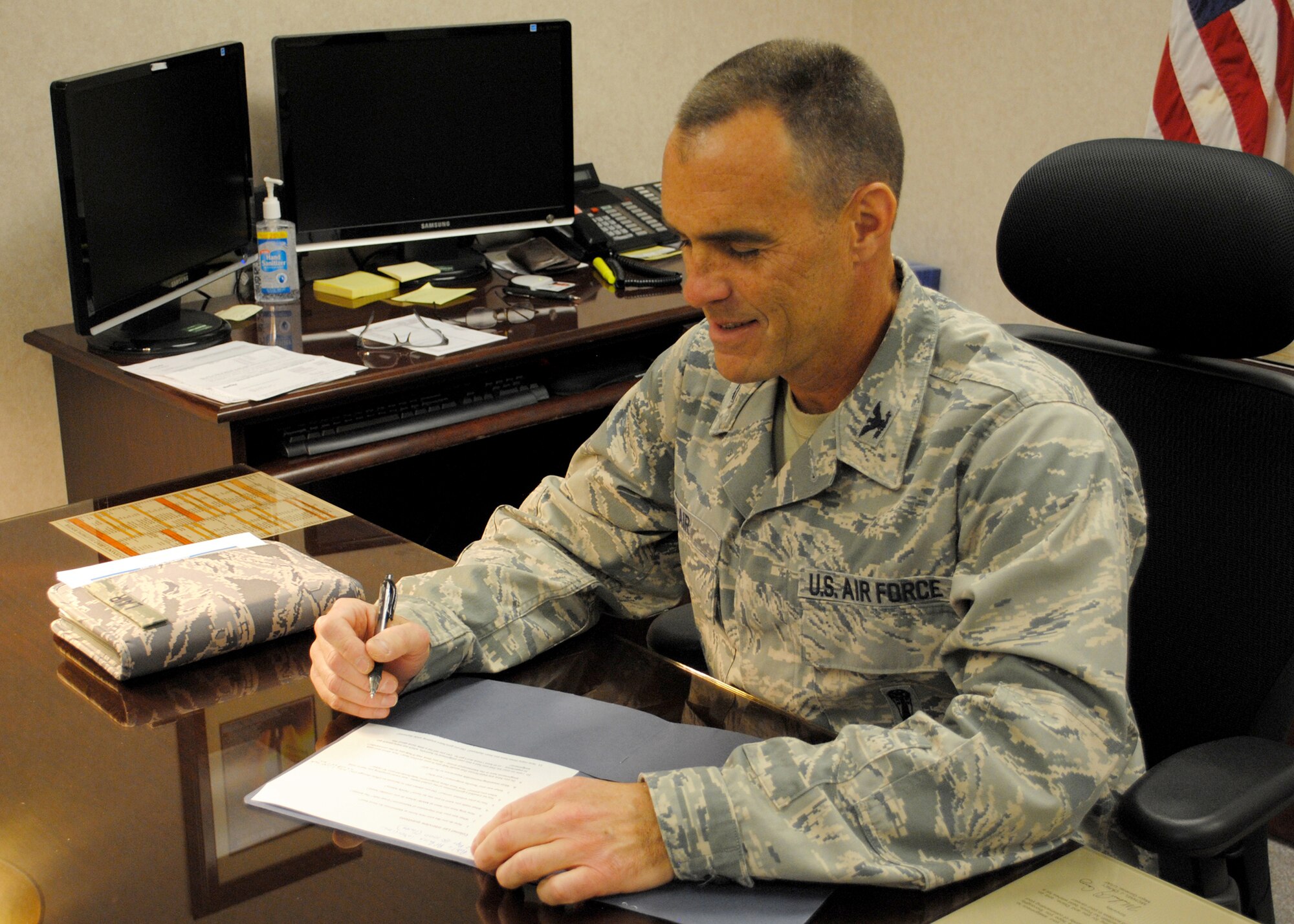 Col. David Lair, 341st Maintenance Group commander, finishes up some paperwork at his desk April 2.  Lair took over as commander of the 341st MXG on March 15.  (U.S. Air Force photo/Senior Airman Cortney Paxton)