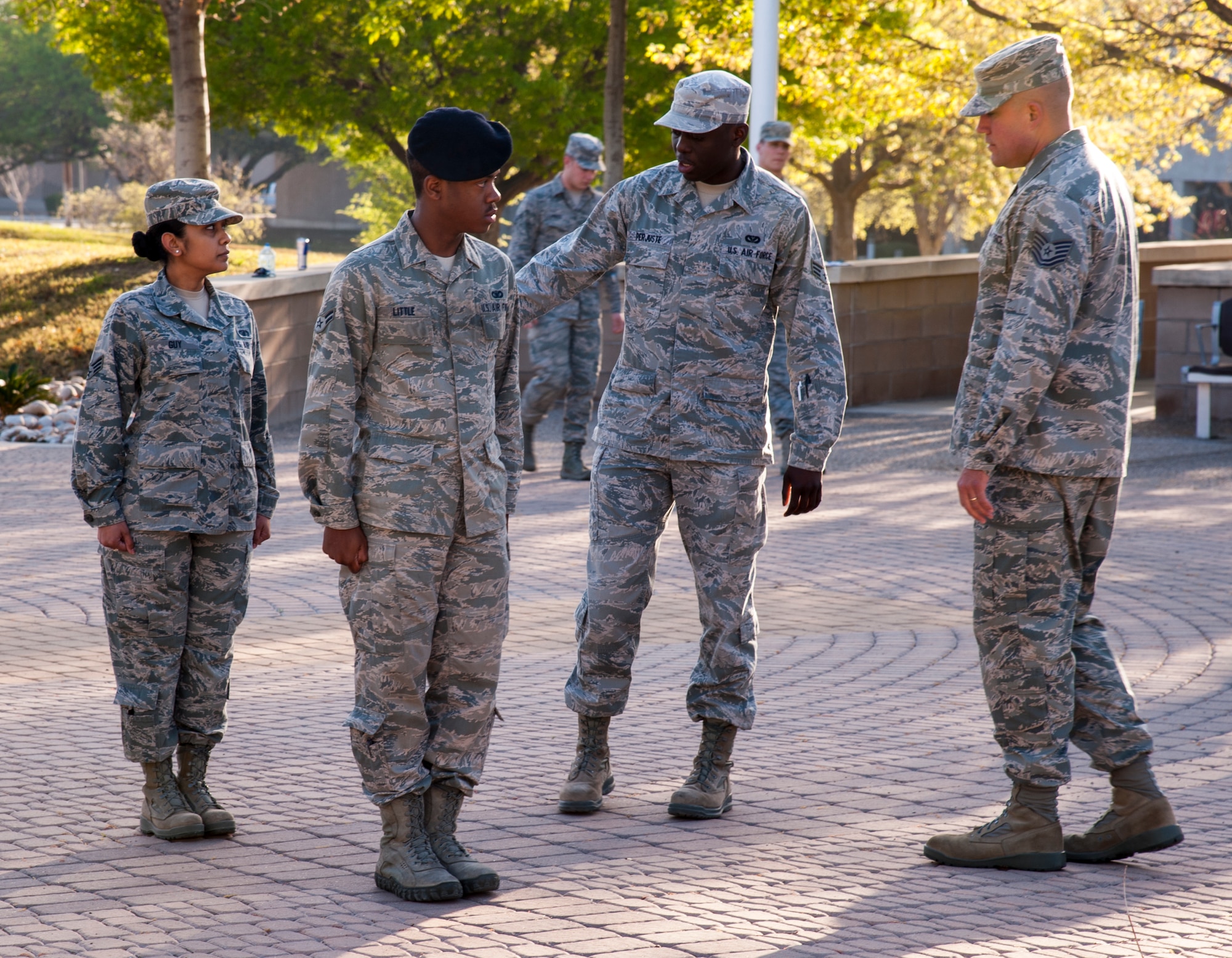 Tech Sgt. Kenneth Bowman observes Laughlin’s Honor Guard as Senior Airman Evens Perjuste leads Senior Airman Leona Guy and Airman 1st Class James Little through a retreat ceremony at Laughlin Air Force Base, Texas, March 14, 2013. Bowman is the NCO in charge of Laughlin’s Honor Guard and is assigned to the 47th Force Support Squadron. He was selected as the 2012 Best Honor Guard Program Manager for Air Education and Training Command’s Flying Training Wings. (U.S. Air Force photo/Senior Airman Nathan Maysonet)