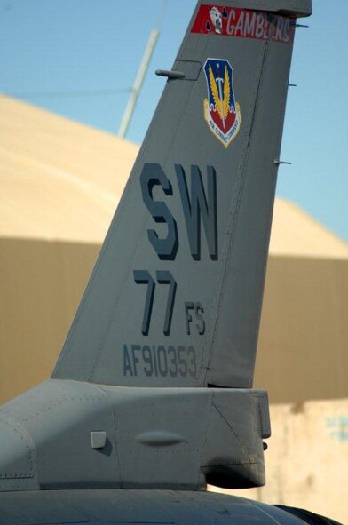 The tail from an U.S. Air Force F-16 Fighting Falcon assigned to the 77th Fighter Squadron from Shaw Air Force Base, S.C. sits in Afghanistan.  The unit conducts close air support missions.  (U.S. Air Force photo by Capt. Elijah Supper/Reased) 