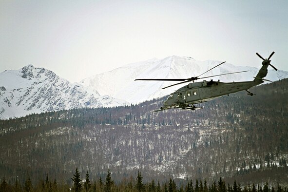 A flight crew with the Alaska Air National Guard's 210th Rescue Squadron conducts training with an HH-60 Pave Hawk helicopter near Bryant Air Field on Joint Base Elmendorf-Richardson Jan. 29, 2013. (Photo by Maj. Guy L. Hayes)