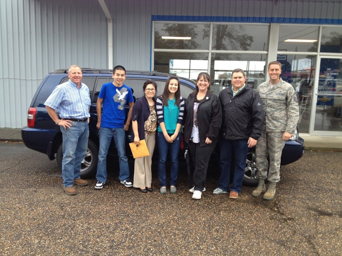 After just purchasing their new auto, the Medley family stands with key personnel who helped them through a very difficult time with their vehicle following the deployment of Master Sgt. Terry Medley.  The Medleys were able to purchase the vehicle from Sellers Chevy in Purvis, Miss.  Included in the photo (from left to right) is the owner of the dealership, Brig Gen. (Ret) Johnny Sellers, David Medley, Songmi Medley, Ashley Medley, Kathie Ladner, MSANG CRTC Commander, Col John Ladner and 172d AW Senior Master Sgt. John Myers.