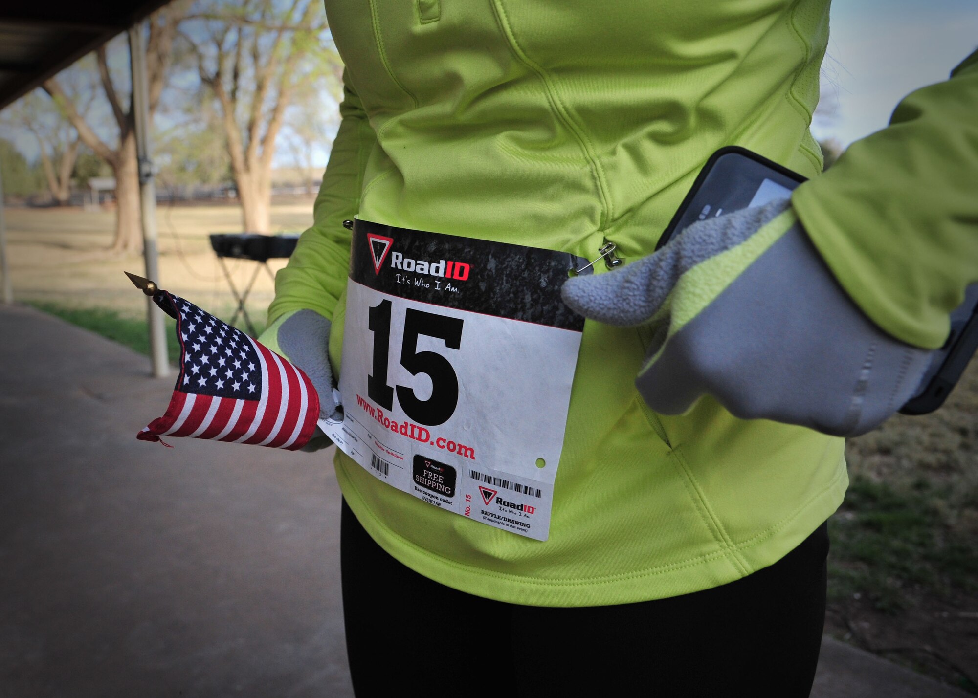 A participant in the 1st Annual Run for Heroes adjusts their runner’s bib before the race at Ned Houk Park in Clovis, N.M., April 6, 2013. The event featured a 5 and 10K, as well as a 400M dash for children and drew in members stationed at Cannon Air Force Base, N.M., as well as the surrounding communities. (U.S. Air Force photo/Senior Airman Alexxis Pons Abascal) 