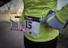 A participant in the 1st Annual Run for Heroes adjusts their runner’s bib before the race at Ned Houk Park in Clovis, N.M., April 6, 2013. The event featured a 5 and 10K, as well as a 400M dash for children and drew in members stationed at Cannon Air Force Base, N.M., as well as the surrounding communities. (U.S. Air Force photo/Senior Airman Alexxis Pons Abascal) 