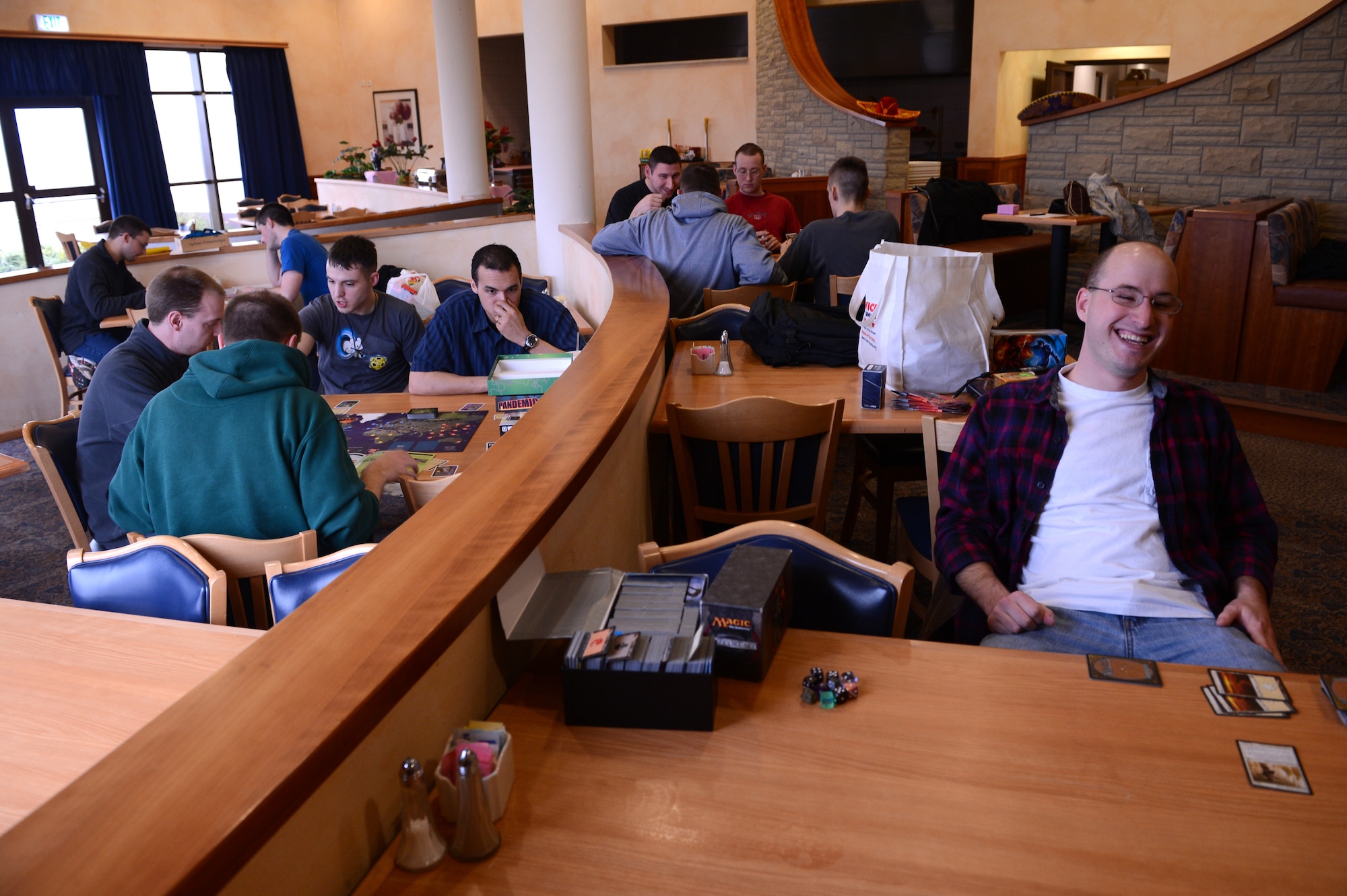 SPANGDAHLEM AIR BASE, Germany – Participants play games during Saturday Game Night at Club Eifel April 6, 2013. The game night brings people from the base community together to play games in a stress-free environment. (U.S. Air Force photo by Airman 1st Class Kyle Gese/Released)