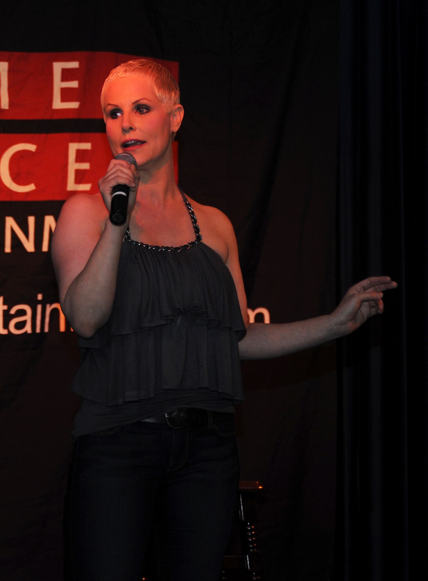 Comedian Alexe Liss performs on stage during a comedy show at the Club Complex April 5, 2013, at Incirlik Air Base, Turkey. Liss and comedian Tommy Davidson both performed during the comedy show for service members and families sponsored by Armed Forces Entertainment. (U.S. Air Force photo by Staff Sgt. Eric Summers Jr./Released)
