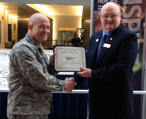 DAYTON, Ohio -- Volunteer Garry Guthrie receives the Team Wright-Patt "Volunteer of the Quarter" award for the fourth quarter of 2012 from 88th Air Base Wing Vice Commander Col. Daniel Semsel. (U.S. Air Force photo)