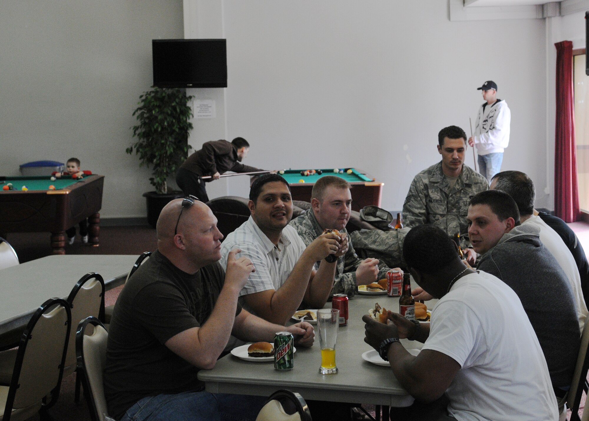 Airmen from the 351st Expeditionary Air Refueling Squadron enjoy their meals April 5, 2013, in Southwest Europe. The barbeque was hosted by the unit as a chance to recognize award winners, promotees and to give Airmen a chance to relax. (U.S. Air Force Photo by 1st Lt. Christopher Mesnard/Released)
