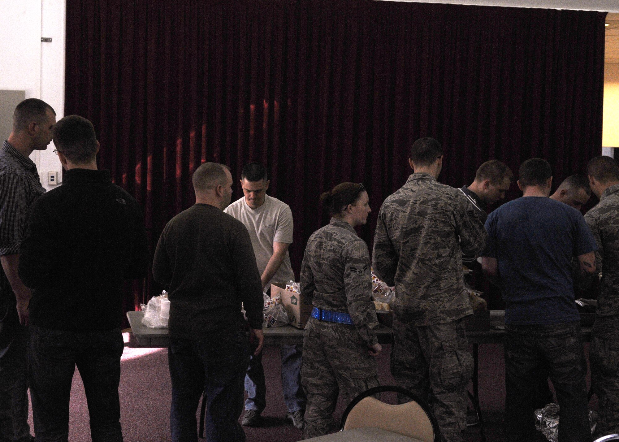 Airmen from the 351st Expeditionary Air Refueling Squadron help themselves to food April 5, 2013 at the squadron’s monthly barbeque. The 351st EARS is currently deployed to Southwest Europe to provide air-to-air refueling for French forces over Mali. (U.S. Air Force Photo by 1st Lt. Christopher Mesnard/Released)