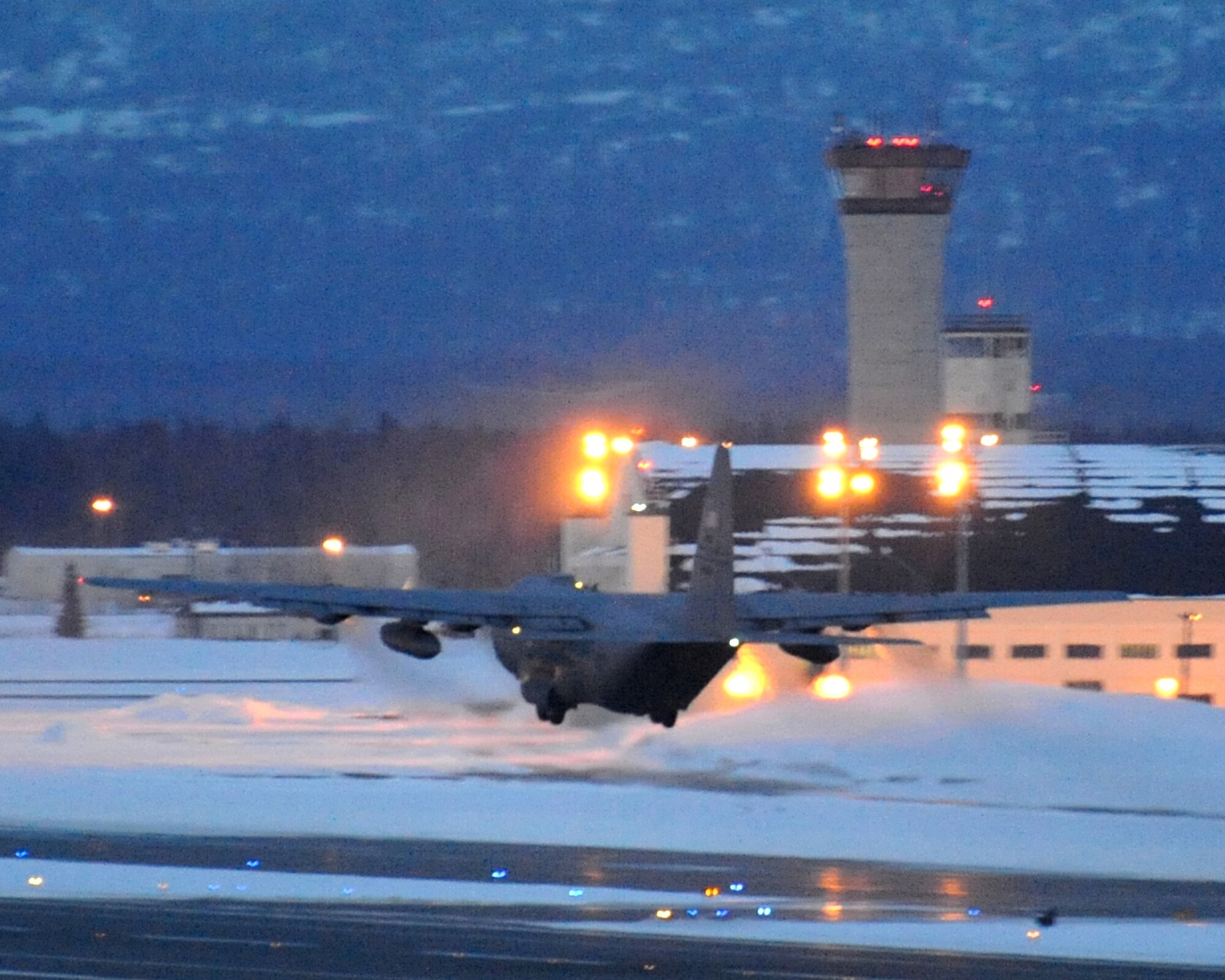 An Air Force C-130 takes off during exercise Polar Force 13-3 at Joint Base Elmendorf-Richards, Alaska, April 7. The readiness exercise is designed to validate the wing's ability to integrate, mobilize, and prepare assigned personnel, aircraft and equipment for their wartime mission and to employ forces and weapons systems to perform the tasked missions. (U.S. Air Force photo/Senior Airman Blake Mize)