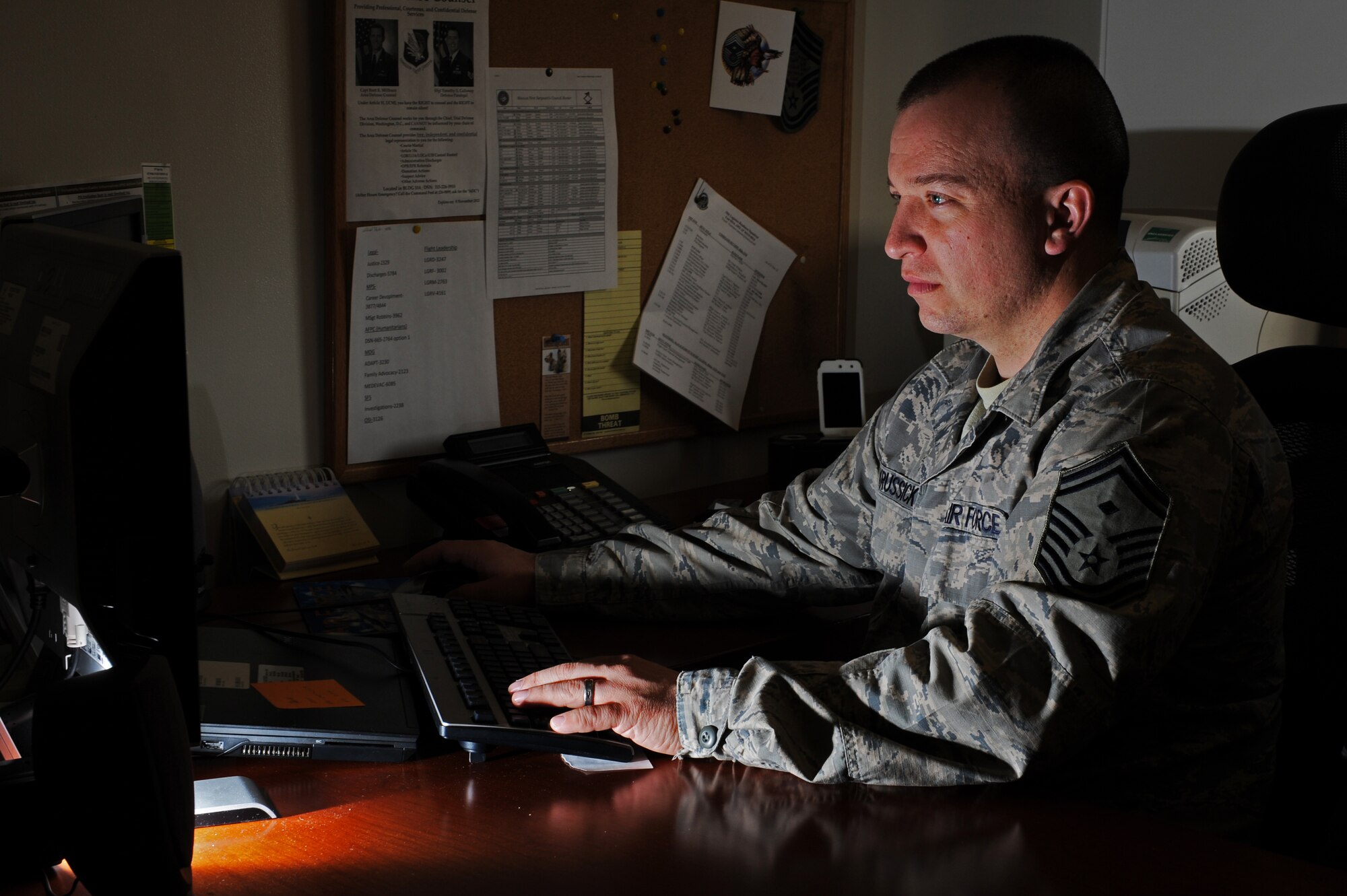U.S. Air Force Senior Master Sergeant Joseph Krussick, 35th Logistics Readiness Squadron first sergeant, sits at his computer at Misawa Air Base, Japan, April 4, 2013. Krussick has been in the Air Force for 19 years and has been a first sergeant for a little over five of those years. (U.S. Air Force photo by Airman 1st Class Kia Atkins)