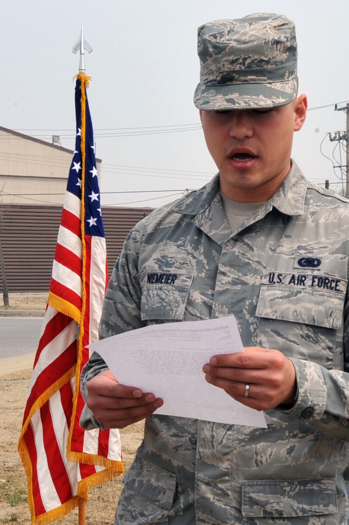 Airman 1st Class Christopher Niemeier, 51st Logistics Readiness Squadron fuels distribution operator, reads a letter from his father in a memorial ceremony for the people who lost their lives in a fuel tank fire in 1986 on April 5, 2013. His father, Larry Niemeier, was stationed at Osan and aided in refilling fire trucks with water and fire retardant. (U.S. Air Force photo/Senior Airman Alexis Siekert)