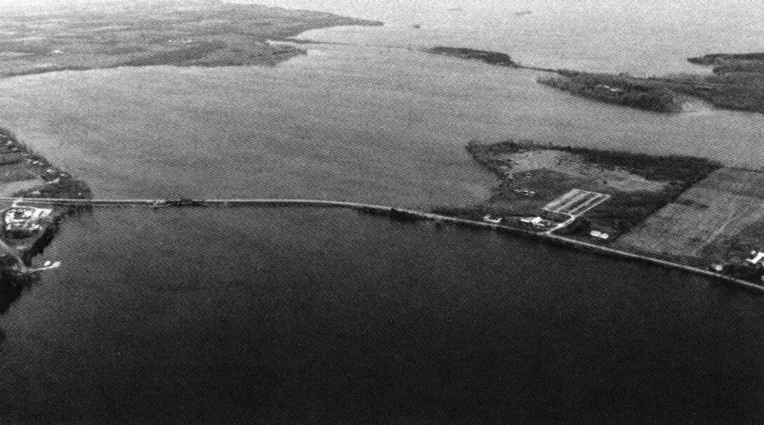 Aerial view of Channel between the North and South Hero Islands. North Hero Island, consisting of the community of North Hero, and South Hero Island, consisting of the communities of Grand Isle and South Hero, are situated in the middle of Lake Champlain, VT. The channel between the islands, locally known as The Gut, lies about 17 miles south of the United States-Canada border. 