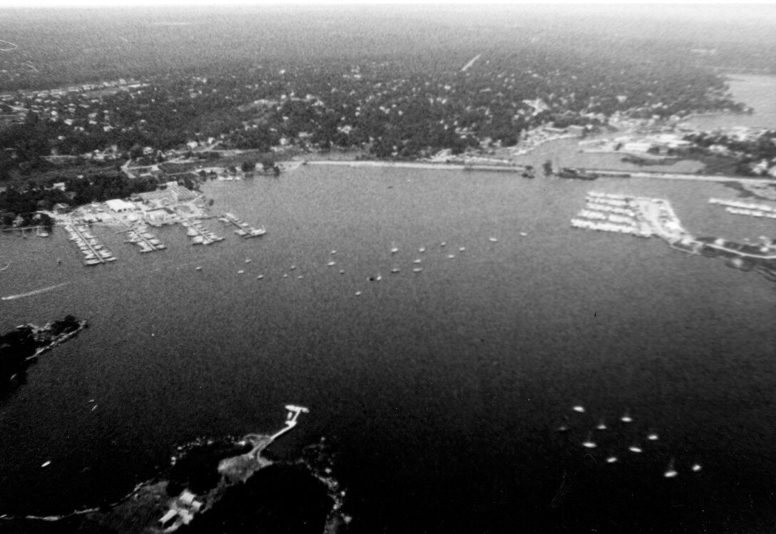 Aerial view of Mystic Harbor. The Mystic River extends from Mystic Harbor in Mystic six miles upstream to Old Mystic. Both Mystic and Old Mystic are sections of Stonington, CT.  Photo was taken in July 1983.