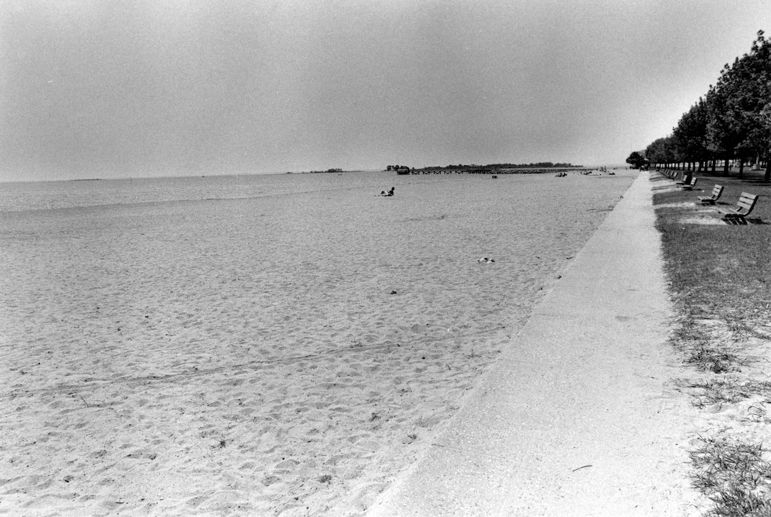 Compo Beach is situated on both the east and west sides of Cedar Point, at the entrance to the Saugatuck River in Westport, CT. Photograph taken in May 1987.