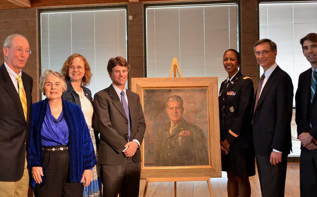 LOS ALAMOS, N.M., -- Participants at Gen. Groves’ portrait dedication ceremony left to right: Mike Wheeler, vice president, Los Alamos Historical Society; Nancy Bartlit, WWII historian; Heather McClenahan, executive director, Los Alamos Historical Society; Geoff Rodgers, Los Alamos County City Council Chair; Lt. Col. Antoinette Gant, commander, Albuquerque district; Charles McMillan, director, Los Alamos National Laboratory; Alan Carr, historian, Los Alamos National Laboratory. 


