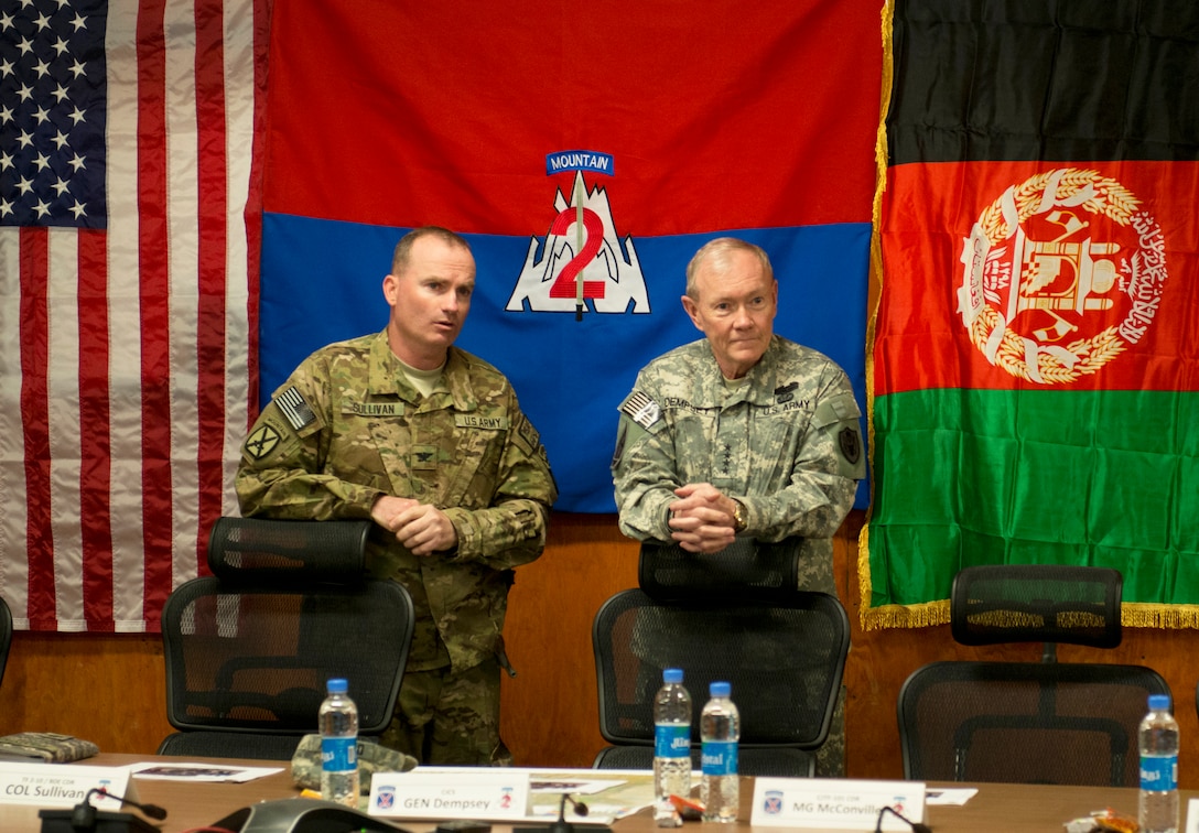 U.S. Army Col. Dennis Sullivan, left, commander of the 10th Mountain Division's 2nd Battalion, leads a briefing for U.S. Army Gen. Martin E. Dempsey, right, chairman of the Joint Chiefs of Staff, on Forward Operating Base Sharana in Paktika province, Afghanistan, April 7, 2013.  