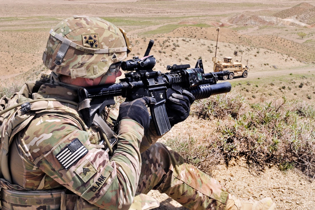 U.S. Army Sgt. Joshua J. Clark provides over watch security for U.S. Air Force Explosive Ordnance Disposal personnel outside an Afghan border police checkpoint near the Afghanistan-Pakistan border in the Spin Boldak district of Afghanistan’s Kandahar province, April 1, 2013. Clark is assigned to the 591st Engineer Company, Sappers, 23rd Infantry Regiment, 4th Striker Brigade Combat Team, Security Force Assistance Team 7.