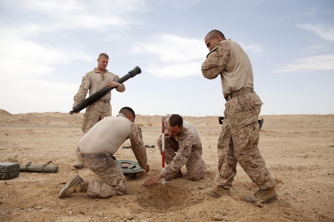 U.S. Marine Corps mortarmen assigned to Weapons Company, 3rd Battalion, 9th Marine Regiment (3/9), set up a M252 81 mm mortar system on forward operating base Payne, Helmand province, Afghanistan, April 3, 2013. The Marines of 3/9 prepared to conduct a night fire mission in order to disrupt enemy activity. (U.S. Marine Corps photo by Cpl. Alejandro Pena/Released)
