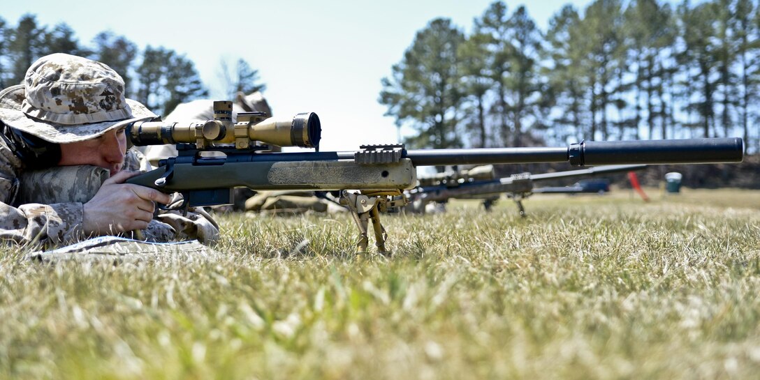 Staff Sgt. Thomas Walsh, training chief, Scout Sniper Platoon, takes aim and gets ready to fire his rifle during a training event at Weapons Training Battalion aboard Marine Corps Base Quantico on April 6, 2013. The unit was cleared to shoot all the way up to 1,000 yards on Range 4. 