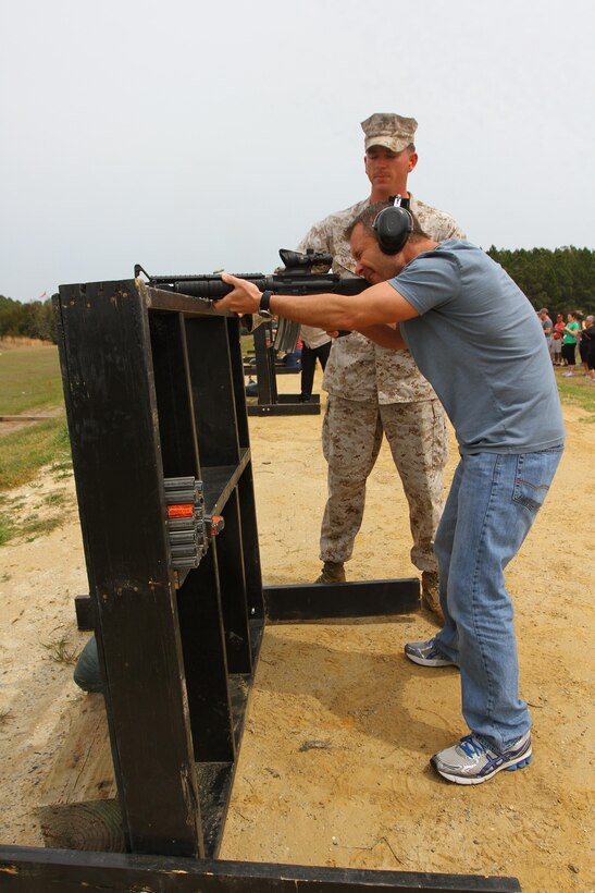 Jeffrey Dudek, the assistant principal for Northwestern Regional High School in Winsted, Conn., shoots an M16-A4 service rifle while taking part in the Educators Workshop on Marine Corps Recruit Depot Parris Island, S.C., April 3, 2013. The workshop brings together teachers, administrators and other education professionals aboard the depot and gives them the opportunity to experience what recruit training is like in the Corps. (U.S. Marine Corps photo by Sgt. Richard Blumenstein)