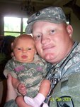 Sgt. 1st Class John Reed holds his newborn baby Ryleigh Alexis who was born May 20, 2008 in Searcy, Arkansas.