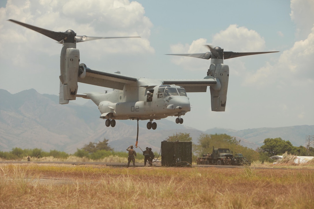 U.S. Marines with Combat Logistics Regiment 37, Landing Support Company practice transporting a quadcon container, utilizing the MV-22 Osprey attached with Marine Medium Tiltrotor Squadron at Subic Bay, Olongapo, Zambales, Philippines, April 8, 2013, in support of exercise Freedom Banner 2013. The purpose of Freedom Banner is to help in the response time to work together effectively to provide relief and assistance in the event of natural disasters and other crises that threaten public safety and health.