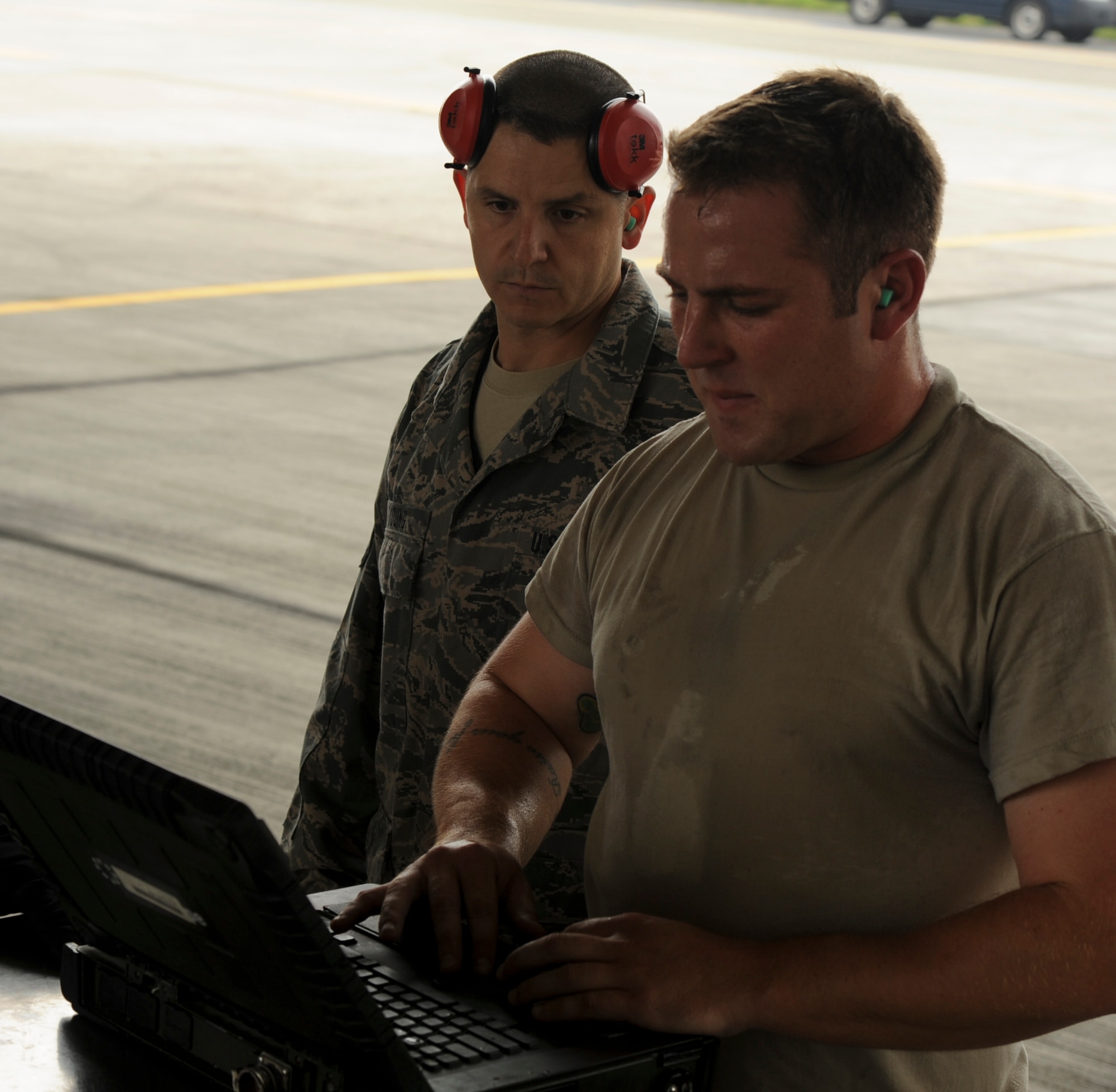 . U.S. Air Force Staff Sgt. Luke McKenzie, 94th Expeditionary Aircraft Maintenance Squadron weapons load crew chief, sweats during a weapons load competition on Kadena Air Base, Japan, April 5, 2013. Competitions like these allow load crews to be recognized and provide people an opportunity to come out and see what they do on a daily basis. (U.S. Air Force photo by Airman 1st Class Justin Veazie)