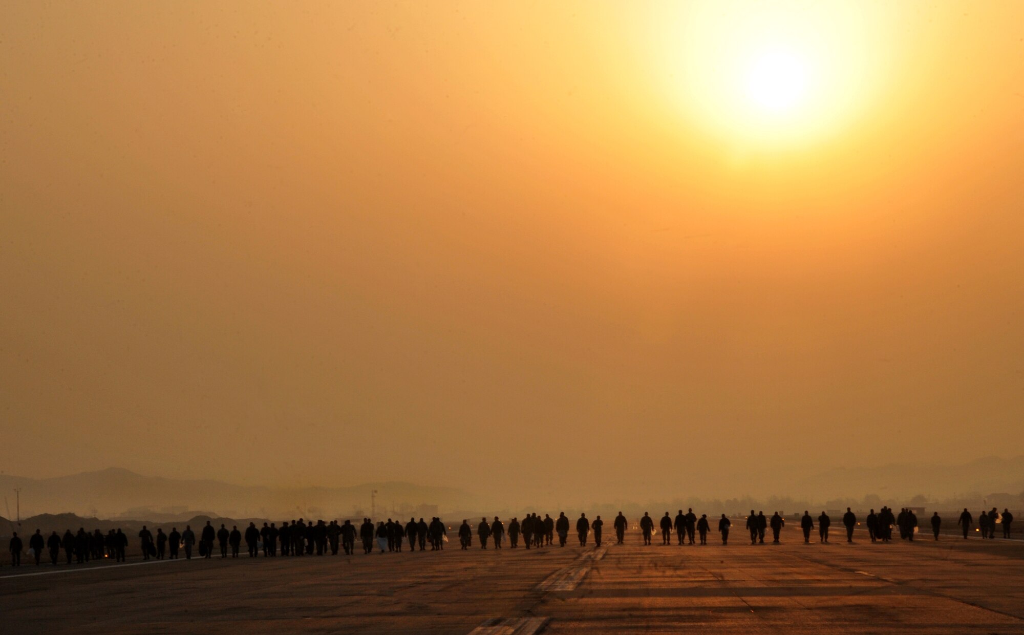 Airmen from the 51st Fighter Wing walk along the flight line searching for
foreign objects and debris during a FOD walk at Osan Air Base, Republic of
Korea, April 8, 2013. More than 700 Airmen participated in the FOD walk and
collected 312 pounds of debris throughout the airfield. The FOD walk kicked
off Osan's base-wide Spring Cleaning Day. (U.S. Air Force photo/Staff Sgt.
Emerson Nuñez)
