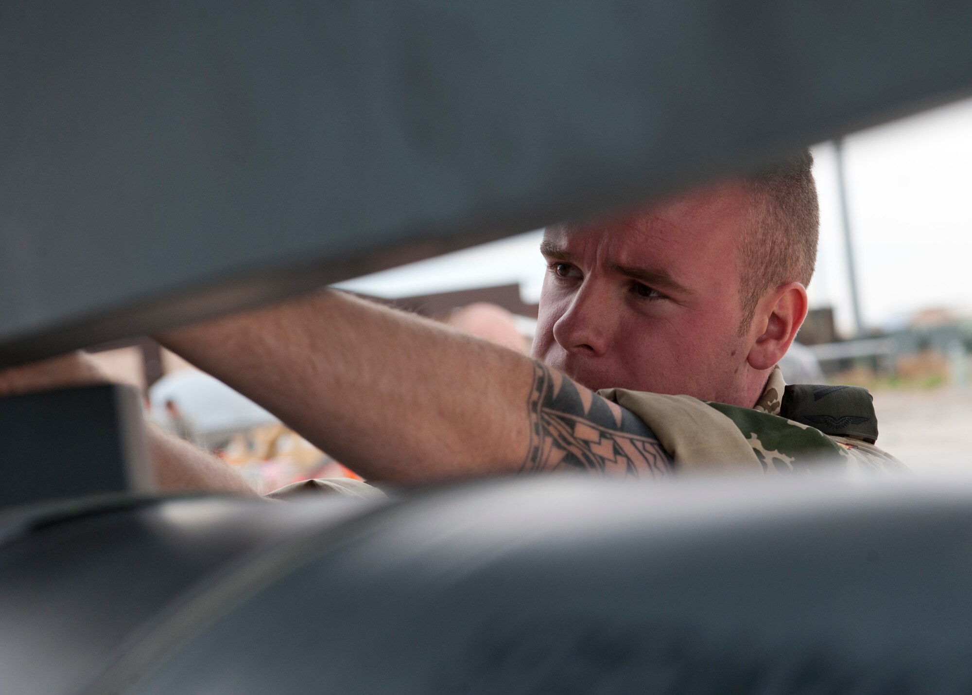 Airman 1st Class Dominik Chritoph, German Air Force Flying Training Center crew chief, prepares a Tornado jet aircraft for inert missile-loading during a quarterly load-crew competition at Holloman Air Force Base, N.M., April 5. The GAF competed in the load-crew competition to have their skills evaluated alongside the F-22 Raptor aircraft and MQ-9 Reaper aircraft load-crews. For the competition, points are awarded during the weapons-loading, tool kit inspection, and uniform inspection. (U.S. Air Force photo by Airman First Class Daniel Liddicoet/Released)