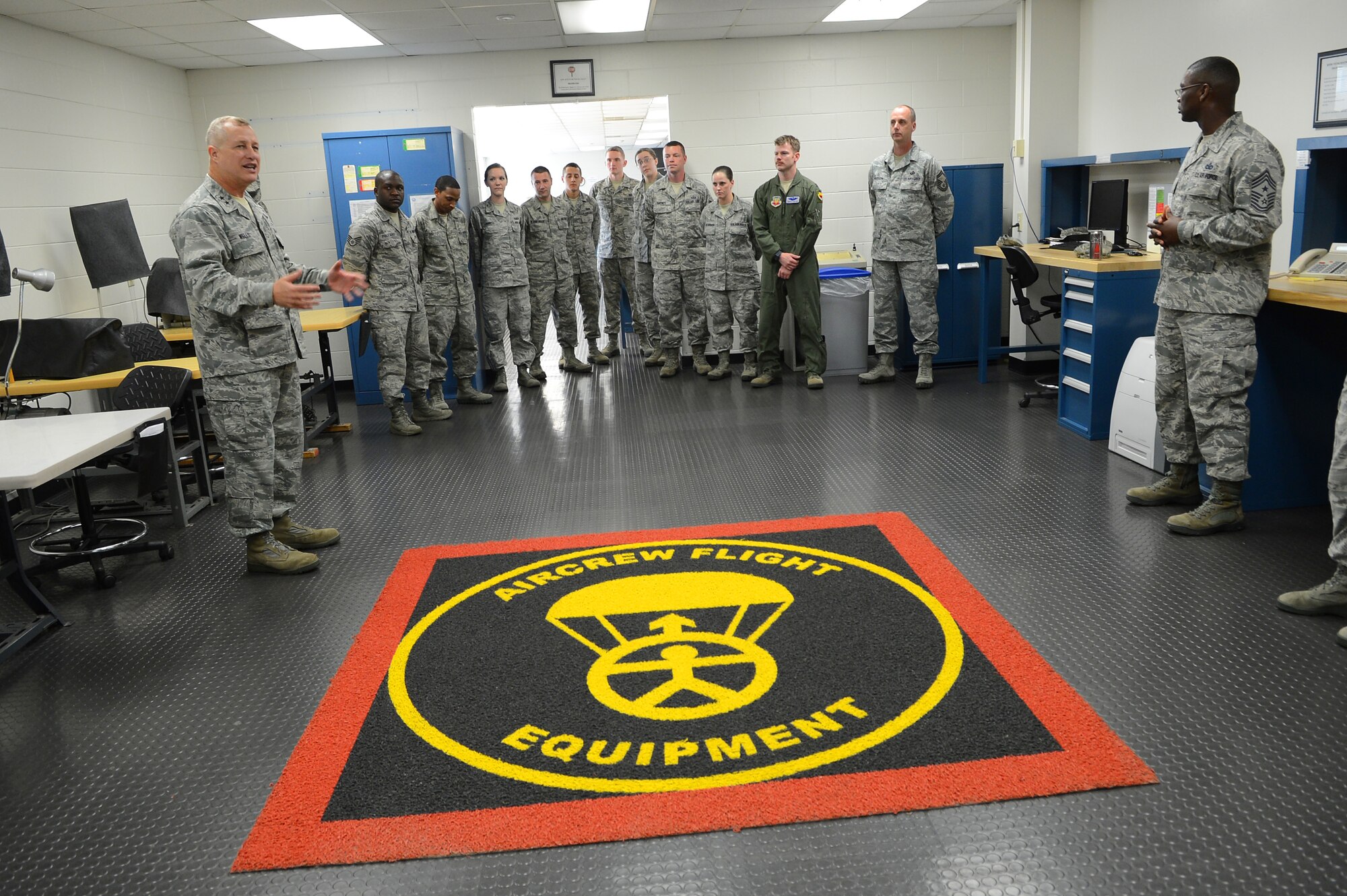 U.S. Air Force Maj. Gen. Lawrence Wells, 9th Air Force commander speaks to Airmen assigned to the 20th Component Maintenance Squadron aircrew flight equipment at Shaw Air Force Base, S.C., April 9, 2013.  Wells visited different squadrons at Shaw for the last time before his retirement.(U.S. Air Force photo by Airman 1st Class Nicole Sikorski/Released)