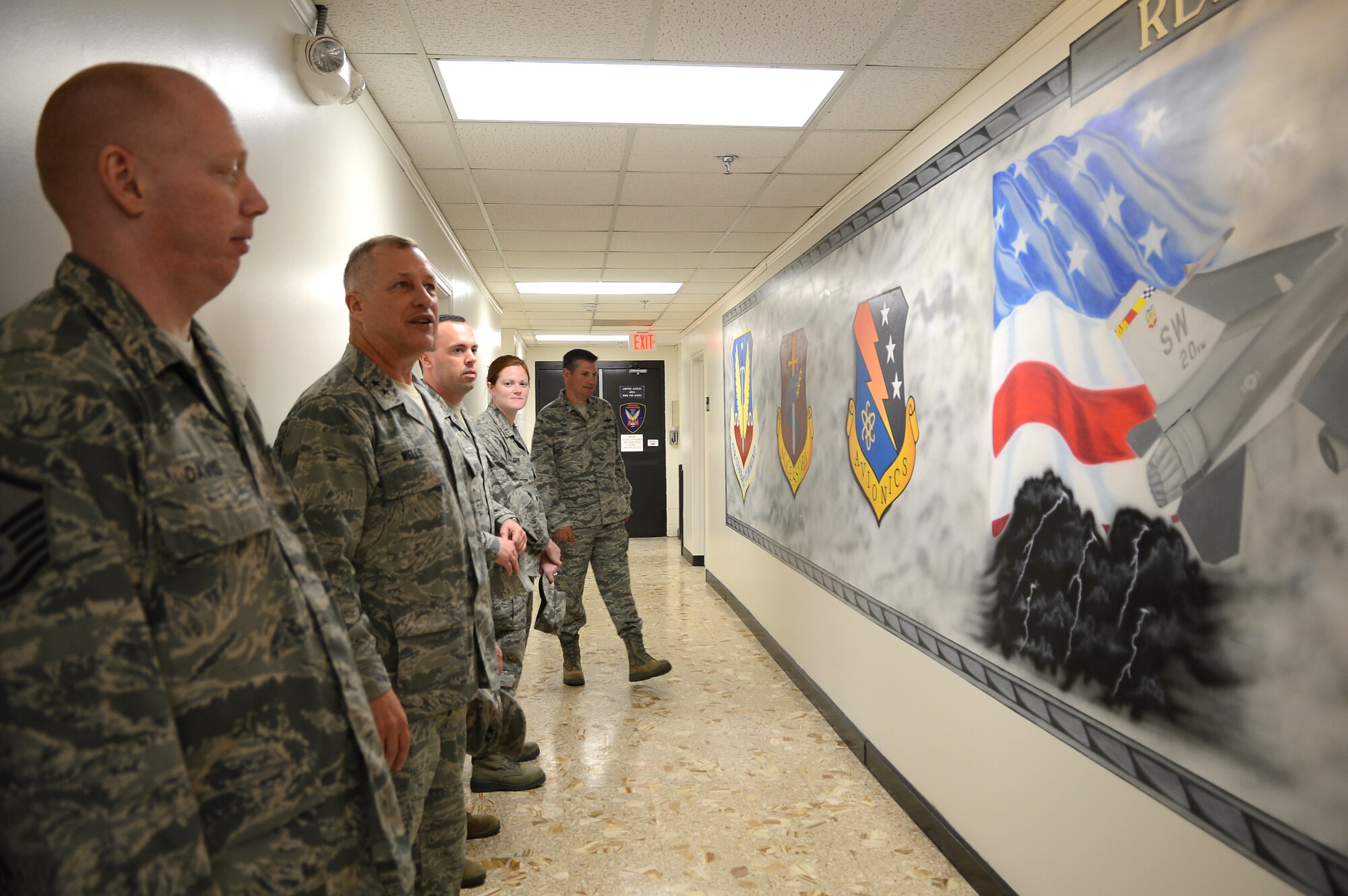 U.S. Air Force Maj. Gen. Lawrence Wells, 9th Air Force commander and Chief Master Sgt. James Davis visit the 20th Component Maintenance Squadron at Shaw Air Force Base, S.C., April 9, 2013.  Wells visited different squadrons at Shaw for the last time before his retirement. (U.S. Air Force photo by Airman 1st Class Nicole Sikorski/Released)