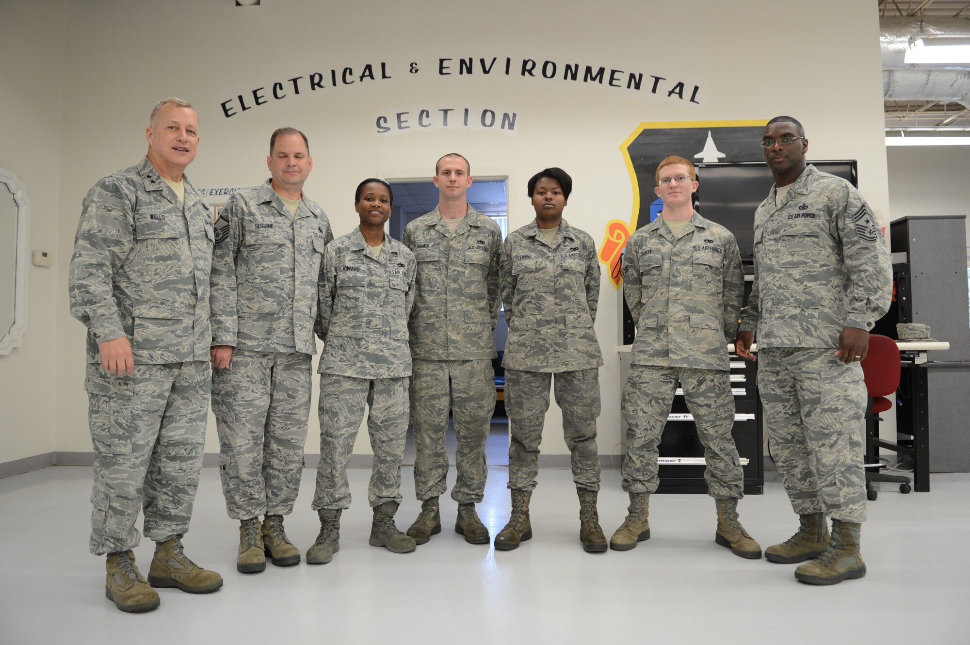 U.S. Air Force Maj. Gen. Lawrence Wells, 9th Air Force commander poses for a photo with Airmen at the 20th Component Maintenance Squadron, Shaw Air Force Base, S.C., April 9, 2013.  Wells visited different squadrons at Shaw for the last time before his retirement. (U.S. Air Force photo by Airman 1st Class Nicole Sikorski/Released)
