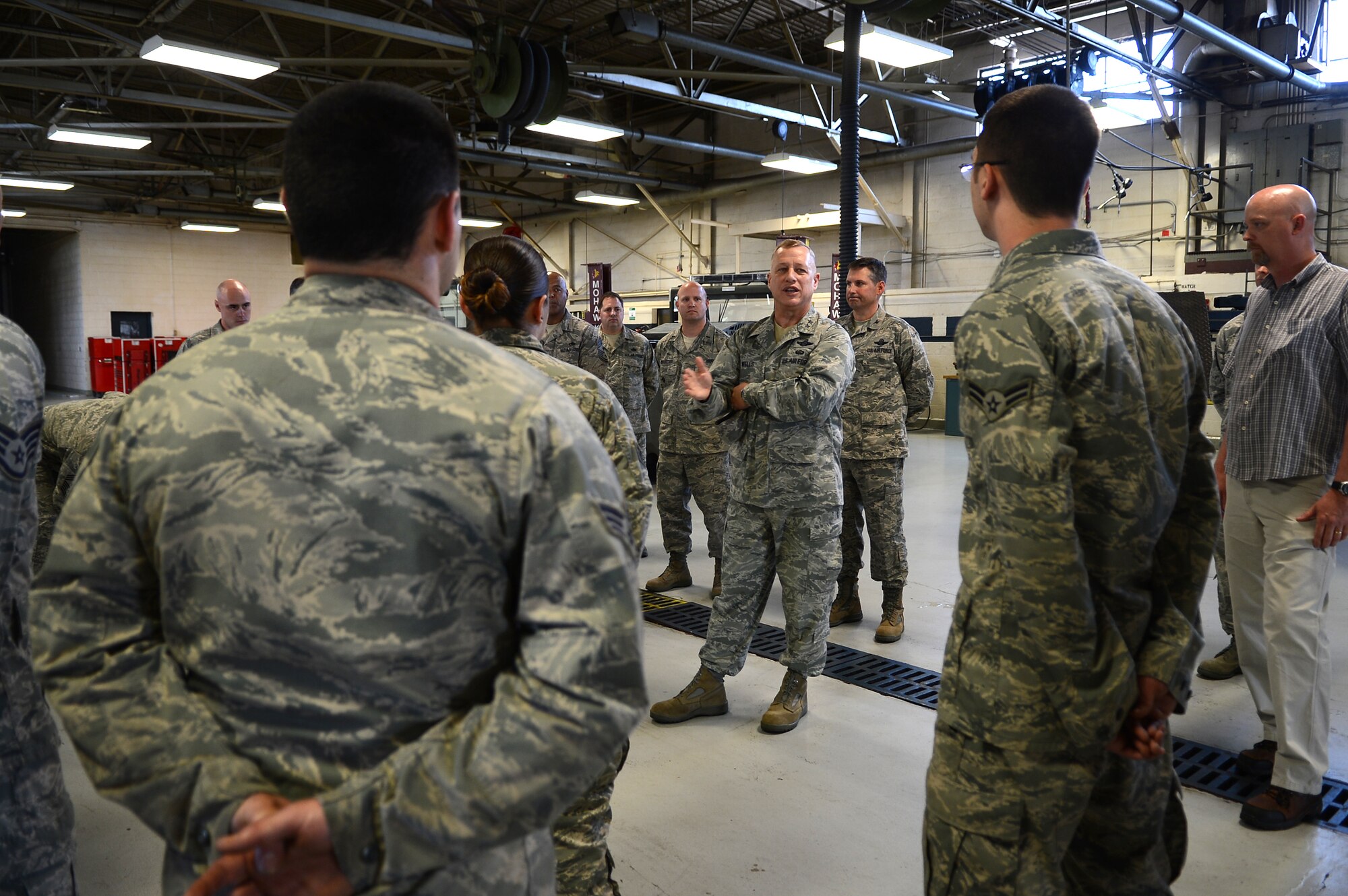 U.S. Air Force Maj. Gen. Lawrence Wells, 9th Air Force commander speaks to Airmen at the 20th Logistics Readiness Squadron vehicle maintenance flight, Shaw Air Force Base, S.C., April 9, 2013.  Wells visited different squadrons at Shaw for the last time before his retirement.  (U.S. Air Force photo by Airman 1st Class Nicole Sikorski/Released)
