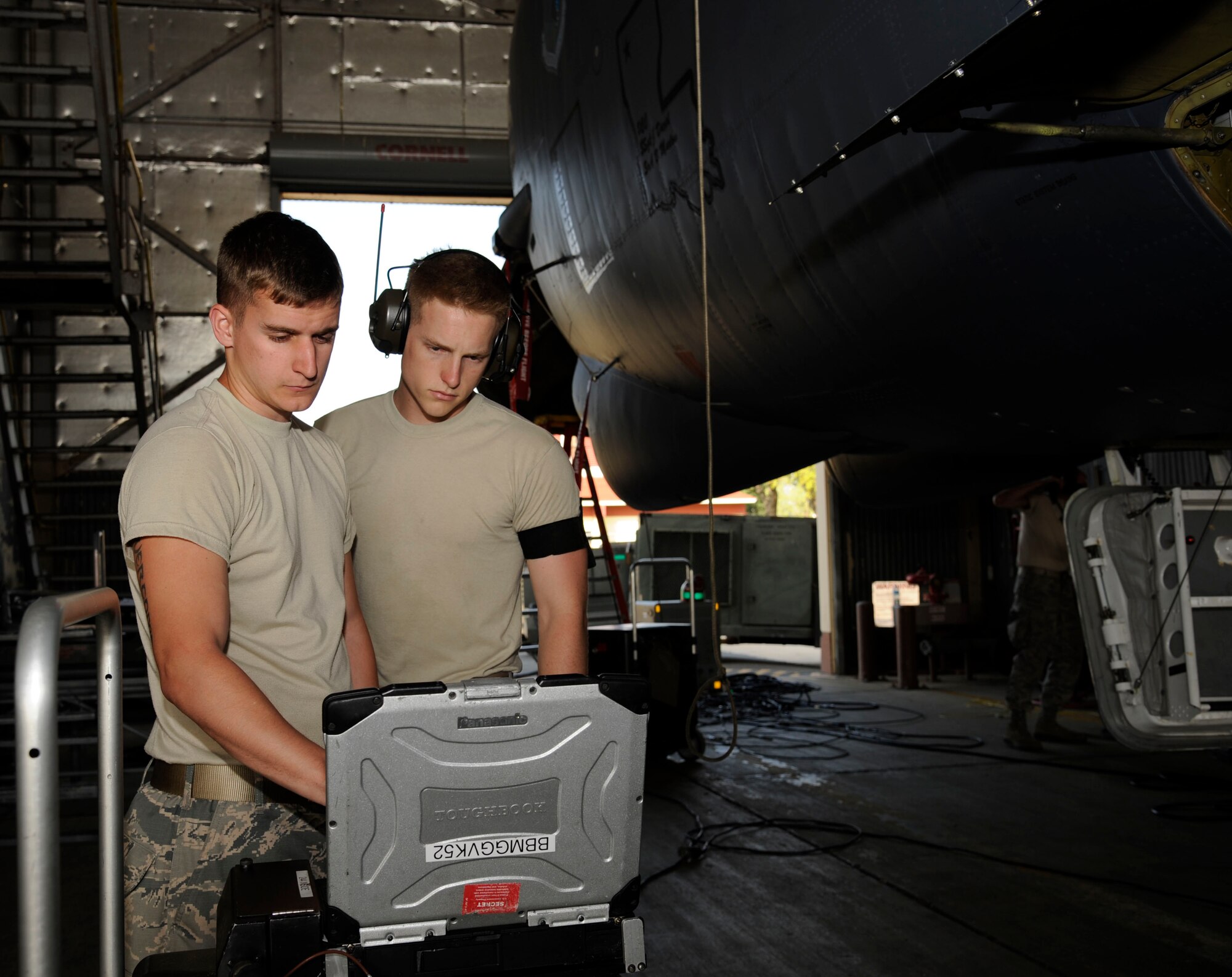Senior Airman Heinz Bartnick, left, and Airman 1st Class Brian Casey, 2nd Maintenance Squadron Avionics section, look over a technical order on Barksdale Air Force Base, La., April 9, 2013. TOs are step-by-step instruction manuals used by maintenance Airmen that list proper tools needed, any hazards to be aware of and protective gear to accomplish the task. (U.S. Air Force photo/Airman 1st Class Andrew Moua)