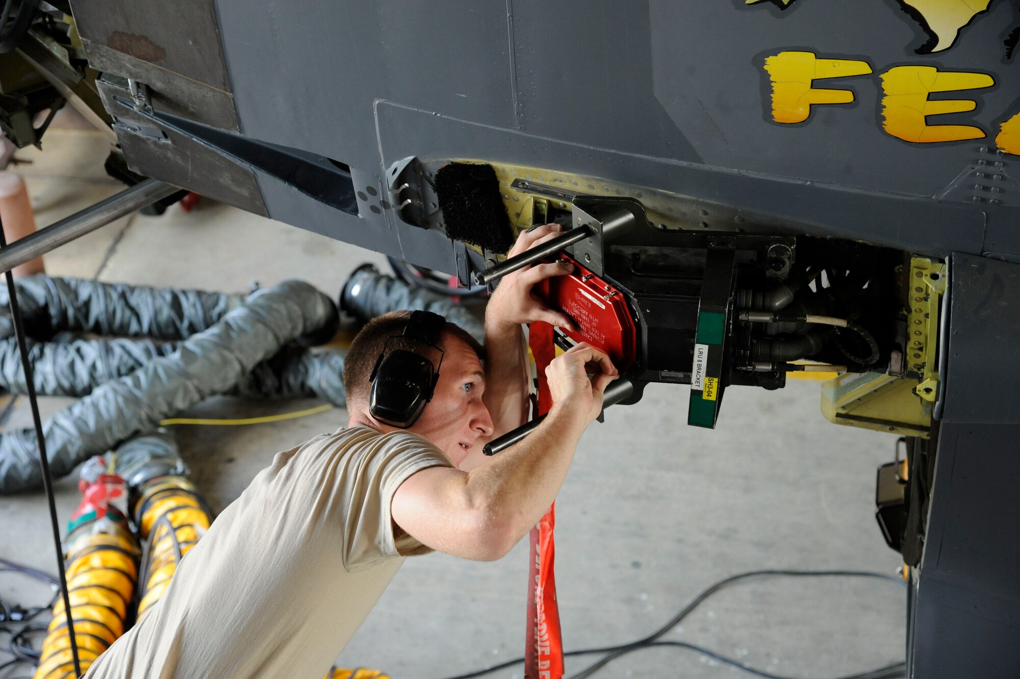 Airman 1st Class Sam Ritzman, 2nd Maintenance Squadron Avionics, places a cover over an ALQ-172 antenna on a B-52H Stratofortress on Barksdale Air Force Base, La., April 9, 2013. Avionics Airmen maintain and test the countermeasure systems to ensure the B-52 evades and disrupts enemy attacks directed toward it by deploying flares or jamming radar. (U.S. Air Force photo/Airman 1st Class Andrew Moua)