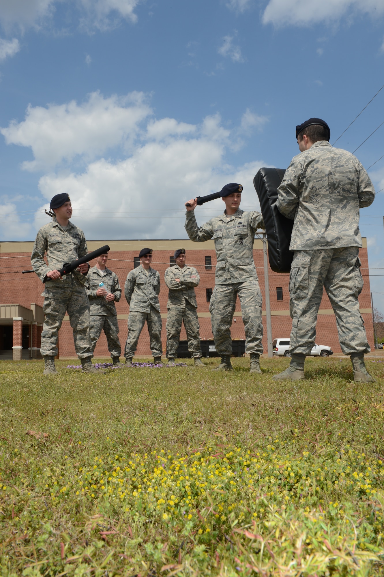 Senior Airman Chandler Hildebrandt, 20th Security Forces Squadron unit trainer, demonstrates how to use a baton for members of the 20th SFS at Shaw Air Force Base, S.C., April 8, 2013. Members of security forces carry various equipment to properly perform their job. Some of their equipment requires security forces members to be trained and certified before they are allowed to carry it on duty. Hildebrandt’s job as the unit trainer is to keep the squadron current with all their certifications and training. (U.S. Air Force photo by Airman 1st Class Krystal M. Jeffers/Released)