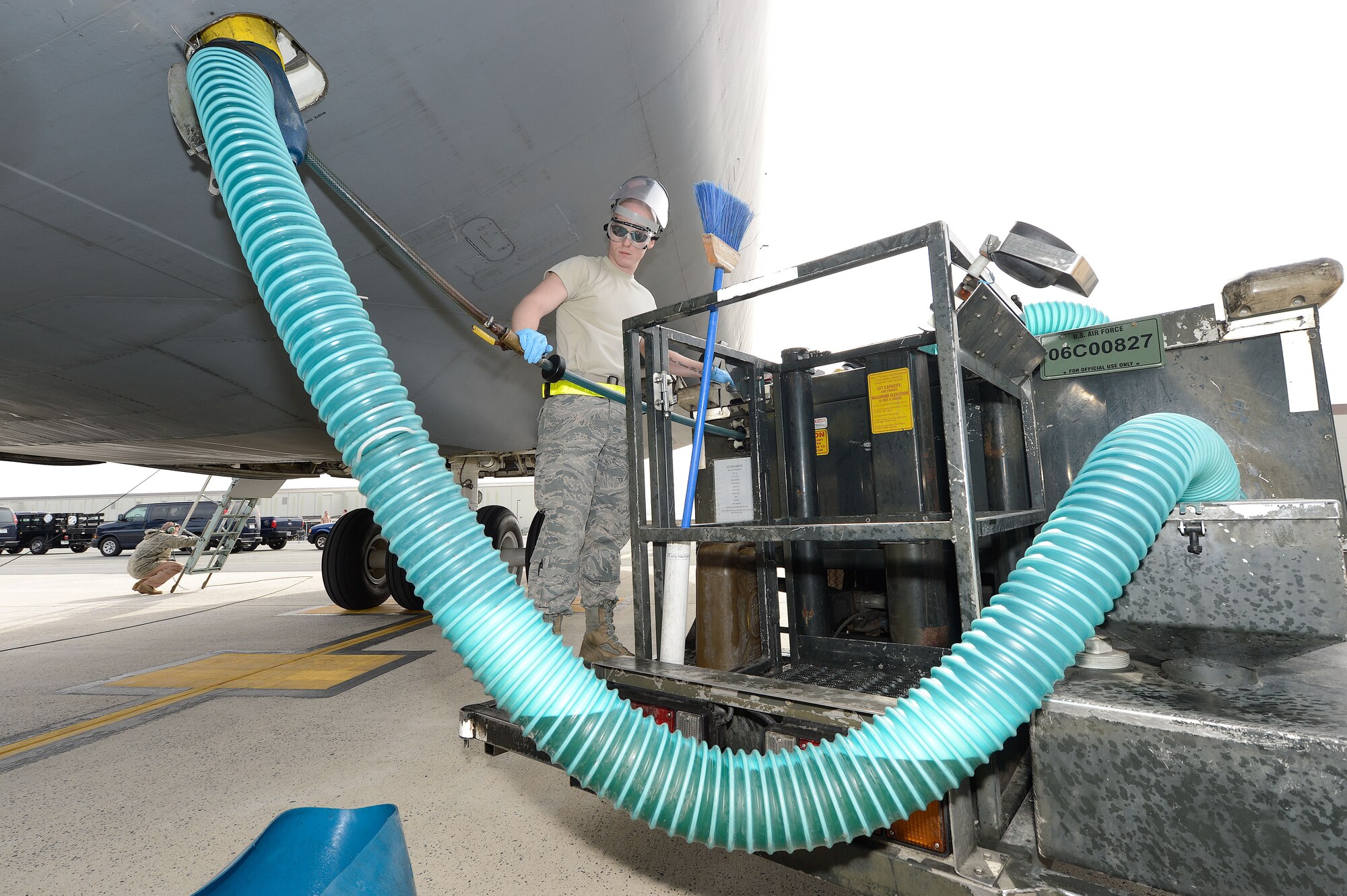 Airman 1st Class Robert Stemmler monitors the transfer of lavatory waste from a C-5A Galaxy to a fleet servicing pump truck immediately after the aircraft has landed, March 11, 2013, Dover Air Force Base, Del. The C-5A Galaxy from the 167th Airlift Wing, West Virginia Air National Guard, has just returned from a mission overseas and will be fully serviced and quickly returned to service by professionals, like A1C Stemmler, of the the 436th Aerial Port Squadron, fleet services section. (U.S. Air Force photo/Greg L. Davis)