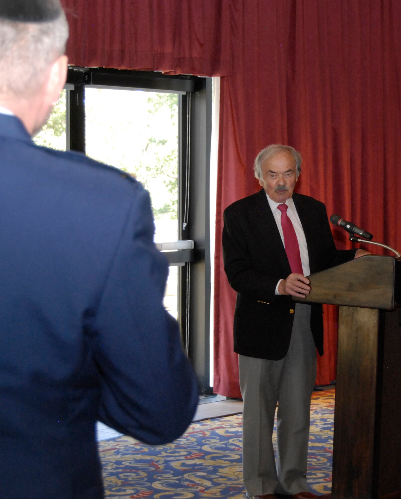 David Bram (right) responds to a question from Chaplain (Maj.) Joshua Narrowe during a Holocaust Remembrance Day luncheon at the Air Force Academy's Falcon Club April 8, 2013. Bram, who survived Auschwitz and other Nazi concentration camps, moved to Colorado Springs in 1954. Narrowe is the Air Force Academy's Jewish chaplain. (U.S. Air Force photo/Don Branum)