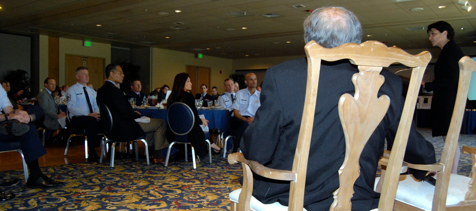Audience members at the Air Force Academy's Holocaust Remembrance Day luncheon listen to a presentation by Renee Rockford (right) in the Falcon Club April 8, 2013. Rockford's father, David Bram (second from right), is a Holocaust survivor who moved to Colorado Springs in 1954. Rockford, who lives in Denver, wrote "The Triumphant Spirit" to chronicle the lives of 100 Holocaust survivors, including Bram. (U.S. Air Force photo/Don Branum)