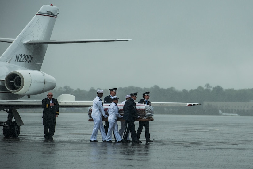 Members of the Joint Base Charleston Honor Guard move the casket containing the body of U.S. Army Chief Warrant Officer 5th Class Curtis Reagan, 43, of Summerville, S.C., toward the hearse April 4, 2013, at Joint Base Charleston – Air Base, S.C. Reagan died March 29, 2013, in Kandahar, Afghanistan, from a non-combat related illness. Reagan’s remains were flown from Dover, Del., to Charleston. (U.S. Air Force photo/ Senior Airman George Goslin)