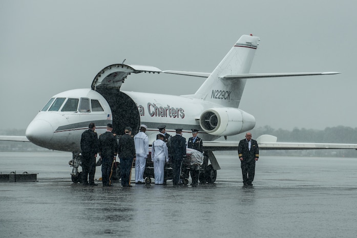 Members of the Joint Base Charleston Honor Guard prepare to move the casket containing the body of U.S. Army Chief Warrant Officer 5th Class Curtis Reagan, 43, of Summerville, S.C., April 4, 2013, at Joint Base Charleston – Air Base, S.C. Reagan died March 29, 2013, in Kandahar, Afghanistan, from a non-combat related illness. Reagan’s remains were flown from Dover, Del., to Charleston. (U.S. Air Force photo/ Senior Airman George Goslin)(RELEASED)
