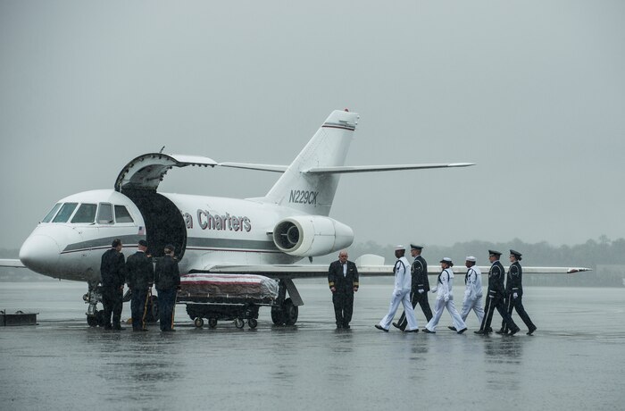 Members of the Joint Base Charleston Honor Guard march toward the casket containing the body of U.S. Army Chief Warrant Officer 5th Class Curtis Reagan, 43, of Summerville, S.C., April 4, 2013, at Joint Base Charleston – Air Base, S.C. Reagan died March 29, 2013, in Kandahar, Afghanistan, from a non-combat related illness. Reagan’s remains were flown from Dover, Del., to Charleston. (U.S. Air Force photo/ Senior Airman George Goslin)(RELEASED)