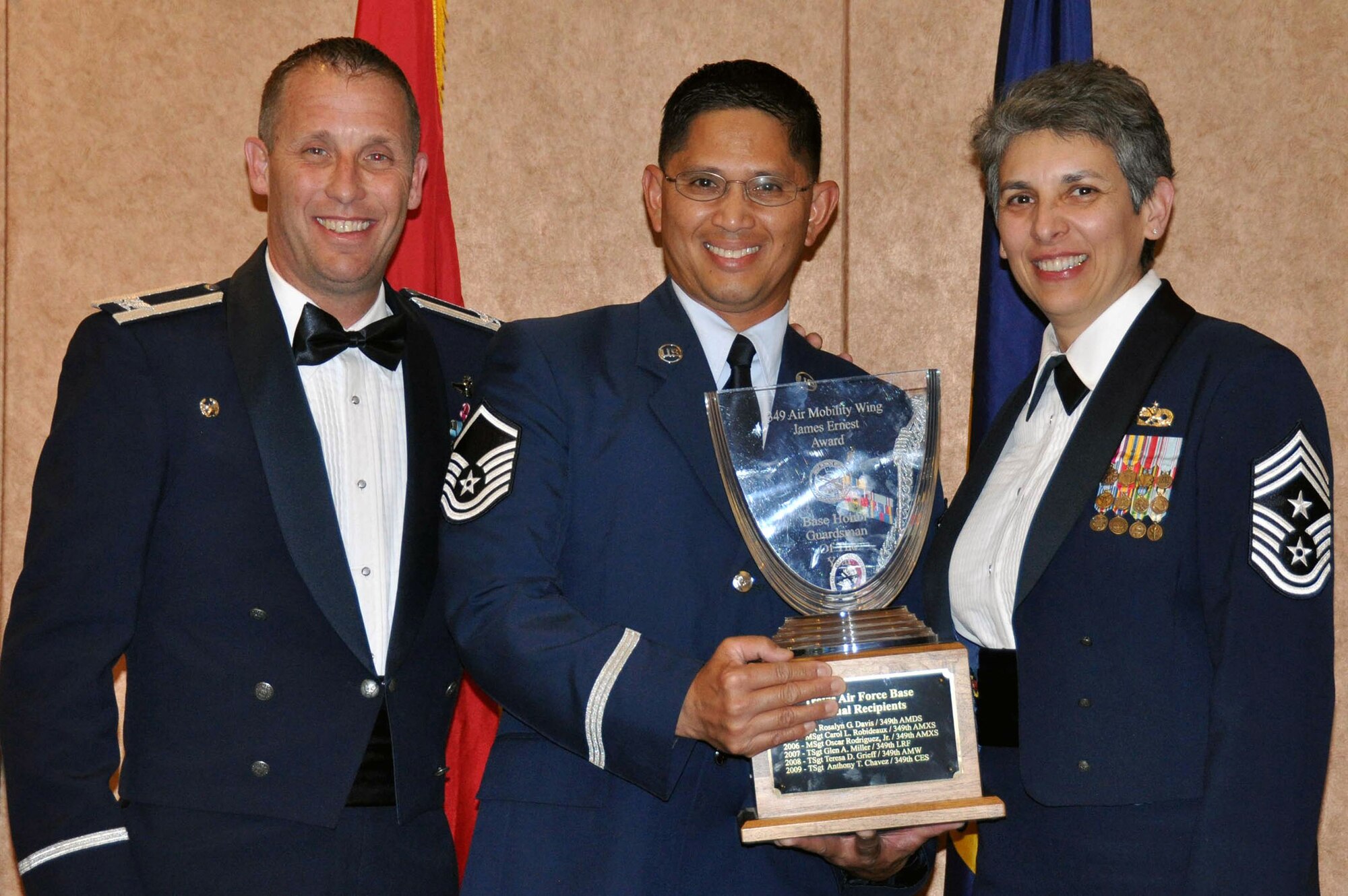 TRAVIS AIR FORCE BASE, Calif. -- Master Sgt. Nelson Almanzor, with the 349th Aerospace Medicine Squadron received the 349th Air Mobility Wing James Ernest Award for Best Honor Guardsman of the Year, March 23, 2013. He was awarded by Col. Matthew Burger 349th AMW Commander and Chief MSgt. Sandra Santos, 349th AMW Command Chief. (U.S. Air Force photo / Senior Airman Cindy G. Alejandrez)