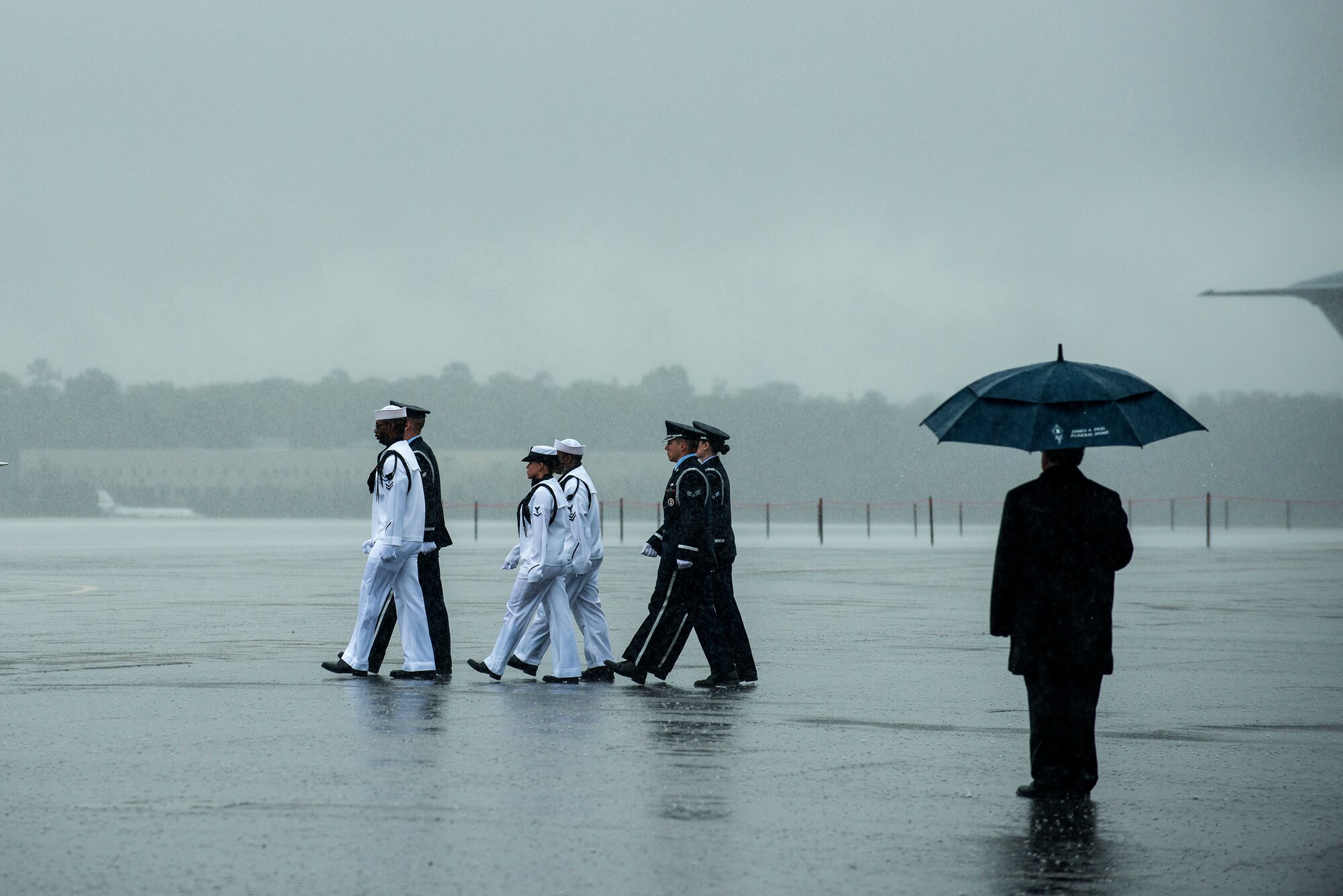 Members of the Joint Base Charleston Honor Guard march toward the casket containing the body of U.S. Army Chief Warrant Officer 5th Class Curtis Reagan, 43, of Summerville, S.C., April 4, 2013, at Joint Base Charleston – Air Base, S.C. Reagan died March 29, 2013, in Kandahar, Afghanistan, from a non-combat related illness. Reagan’s remains were flown from Dover, Del., to Charleston. (U.S. Air Force photo/ Senior Airman George Goslin)(RELEASED)