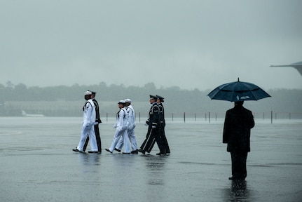 Members of the Joint Base Charleston Honor Guard march toward the casket containing the body of U.S. Army Chief Warrant Officer 5th Class Curtis Reagan, 43, of Summerville, S.C., April 4, 2013, at Joint Base Charleston – Air Base, S.C. Reagan died March 29, 2013, in Kandahar, Afghanistan, from a non-combat related illness. Reagan’s remains were flown from Dover, Del., to Charleston. (U.S. Air Force photo/ Senior Airman George Goslin)(RELEASED)