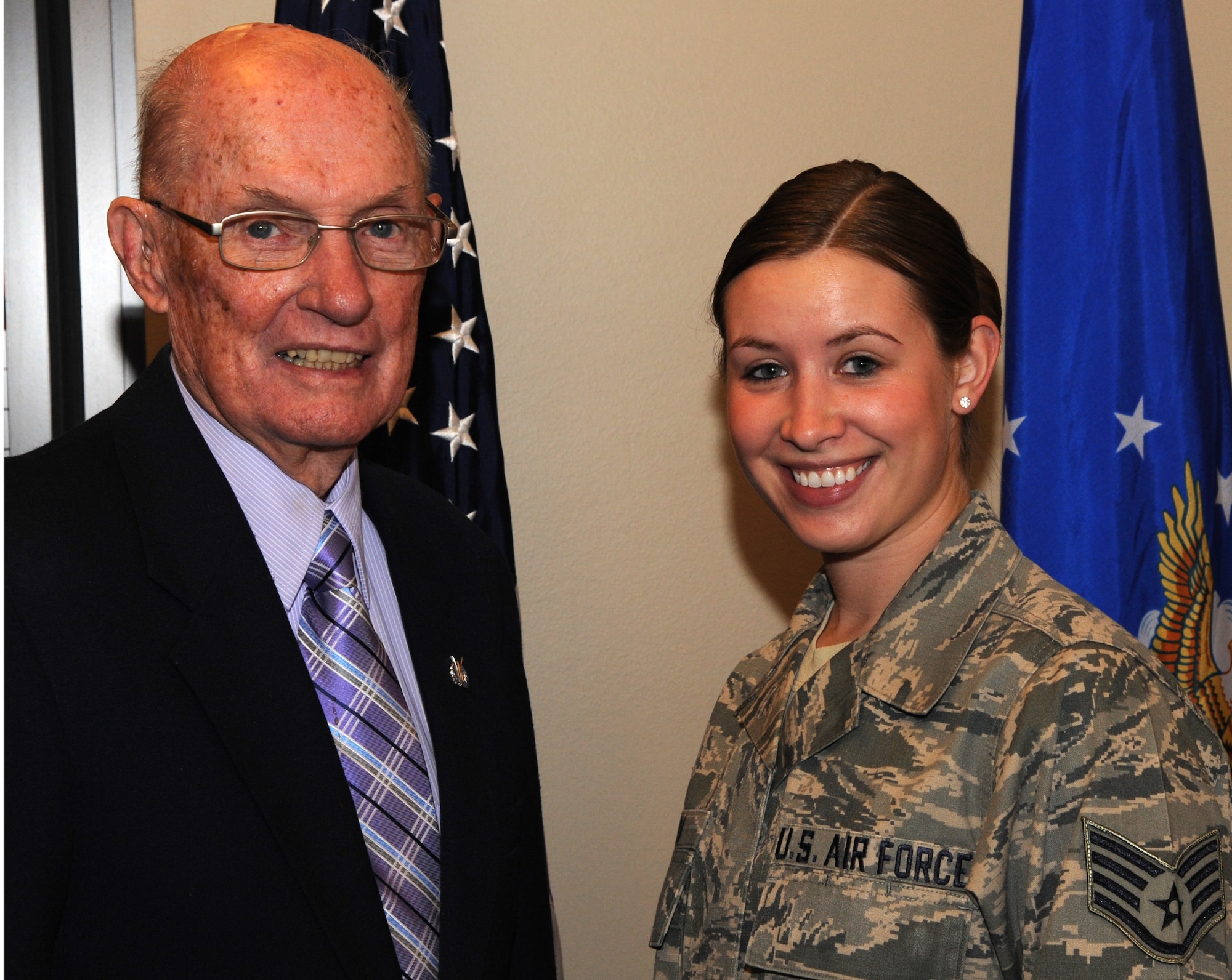 James McCoy, former Chief Master Sgt. of the Air Force and Staff Sgt. Sarah Nava, a technician with the Headquarters Air Force Space Command command support staff, pose for a photo after breakfast with Team Pete Airmen during McCoy’s visit here March 26. During the breakfast McCoy emphasized the importance of education and continued growth as an Air Force professional. McCoy also visited with Airmen at the Air Force Academy and Schriever and Buckley Air Force Bases. (U.S. Air Force photo/Staff Sgt. Aaron Breeden)