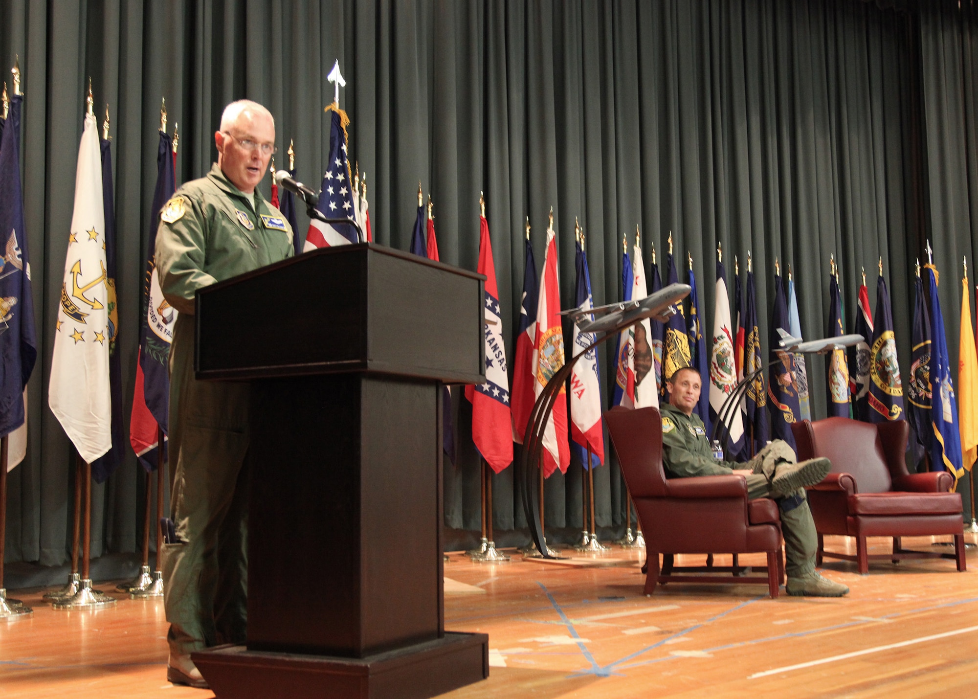 TRAVIS AIR FORCE BASE, Calif. -- Col. Scott L. McLaughlin speaks at the ceremony where he assumed command of the 349th Operations Group at Travis Air Force Base, Calif., April 7, 2013. Col. Matthew J. Burger (right), commander of the 349th Air Mobility Wing, was the presiding officer. "During my 20 plus years in the Air Force, I've always viewed Travis Air Force Base as the epitome of global reach execution," said Colonel McLaughlin. "I am extremely happy to be part of the Travis Team."  In his new position, Colonel McLaughlin will oversee the largest, most diverse operations group in the Air Force Reserve Command, comprised of one C-5 Galaxy squadron, two KC-10A Extender squadrons, one C-17 Globemaster III squadron, an aeromedical evacuation squadron, an operations support flight, and an airlift control flight. (U.S. Air Force photo / Lt. Col. Robert Couse-Baker)