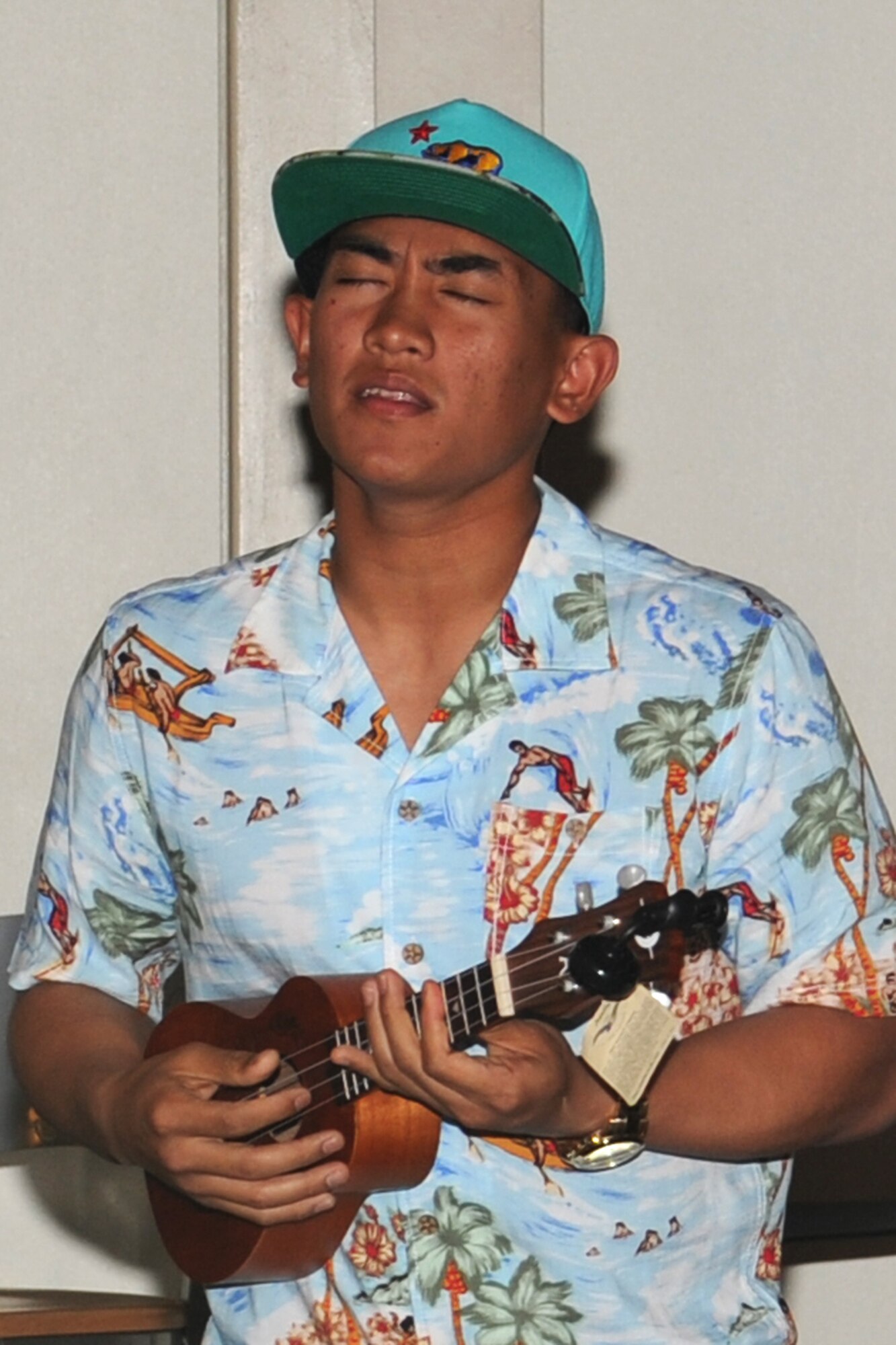 GOODFELLOW AIR FORCE BASE, Texas-- Airman JR Baltazar, 315th Training Squadron student, plays the ukulele during the Crossroads talent show on base, April 6. (U.S. Air Force photo/Staff Sgt. Laura R. McFarlane)