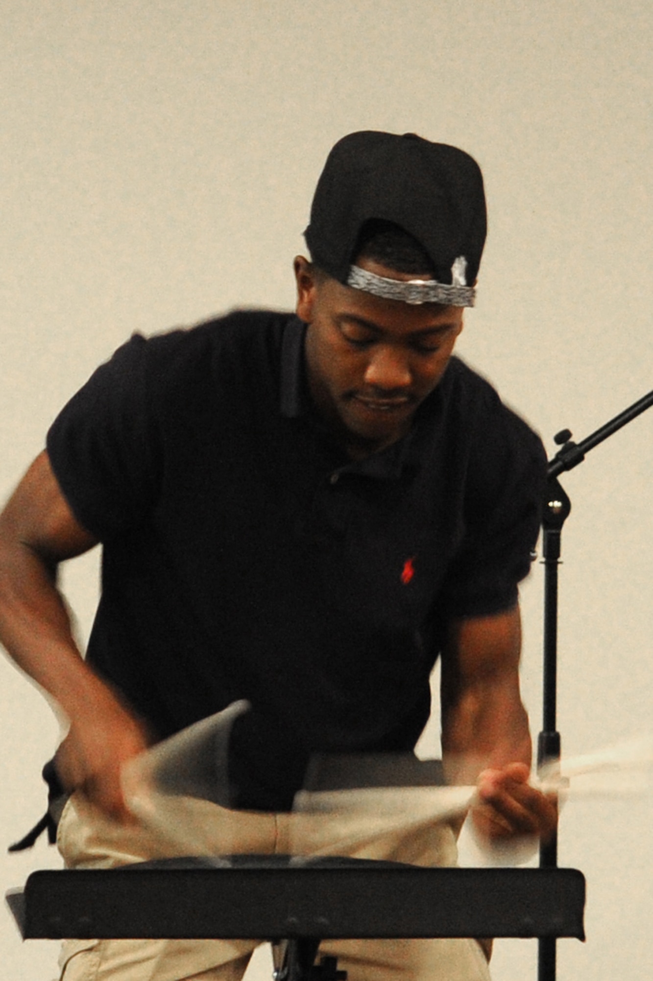GOODFELLOW AIR FORCE BASE, Texas-- Airman 1st Class James Pre Vard, Jr., 312th Training Squadron student, plays a drum pad during the Crossroads talent show on base April 6. Pre Vard, Jr. took second place. (U.S. Air Force photo/ Staff Sgt. Laura R. McFarlane)