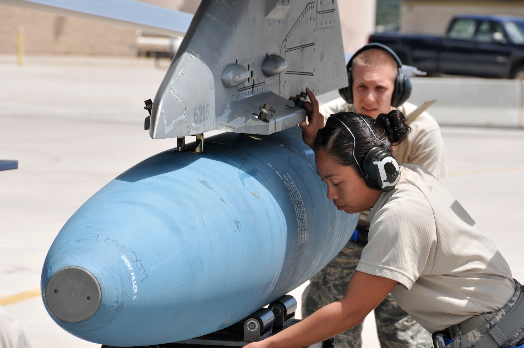 Staff Sgt. Danessa Gali, 495th Fighter Group, Detachment 93, loads a bomb onto an F-16 during the 482nd Aircraft Maintenance Squadron’s Quarterly Load Crew Competition at Homestead Air Reserve Base, Fla., April 7. The load crews were evaluated in four areas to determine the winner: dress and personal appearance, tool kit inspection, a general knowledge test, and actual munitions loading to include speed and proficiency. (U.S. Air Force photo/Senior Airman Nicholas Caceres) 